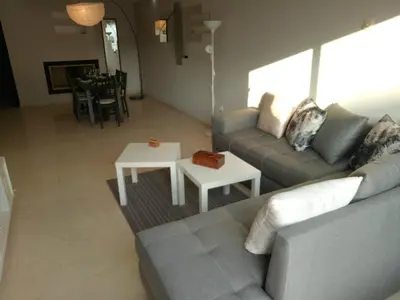a living room with a couch and a table at Apartment with Terrace in Casablanca