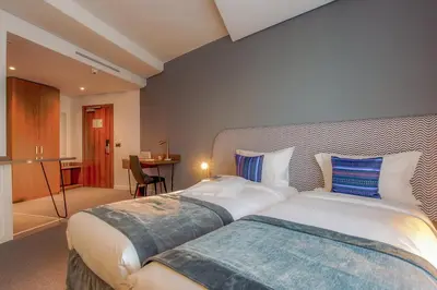 a bedroom with a large bed in a room at Kyriad Residence Casablanca in Casablanca