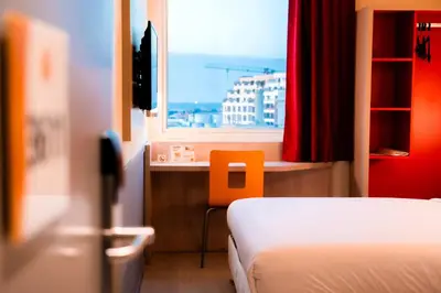 a hotel room with a bed and a window at Premiere Classe Casablanca Centre Ville in Casablanca