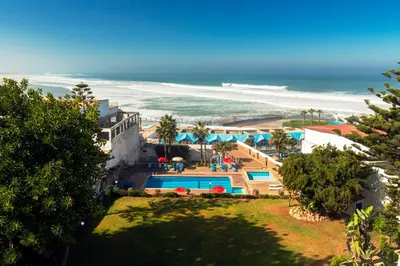 an aerial view of a resort and the beach at Hotel Bellerive in Casablanca