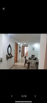 a living room with a table and a mirror at home zen in Rabat