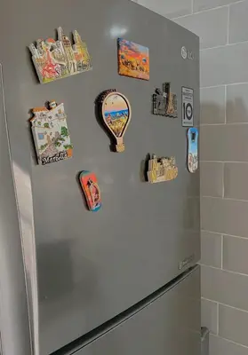 a refrigerator with magnets on the side of it at Luxury résidence Taj Nouaceur in Nouaseur