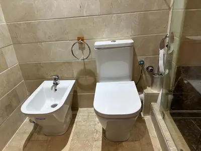 a bathroom with a toilet and a sink at Appartement Casablanca vue sur mer in Casablanca