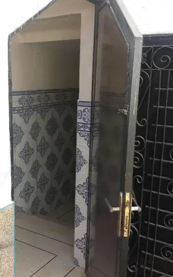 an open door in a room with a tile wall at Dream House Sidi Rahal Beach in Sidi Rahal