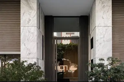 a glass door to a building with a basketball hoop in the window at COMFORTABLE & ELEGANT FLAT IN A LIVELY PLACE by ShortstayMaroc in Casablanca