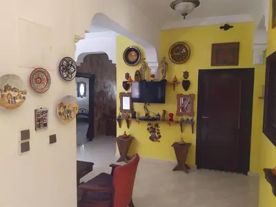 a room with a bunch of plates on the wall at appartement a casablanca in Casablanca