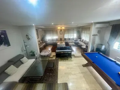 an aerial view of a living room with a pool table at Au Cœur Des Plages de Rabat in Oulad Kerroum