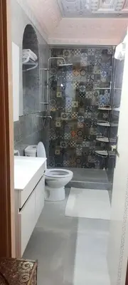 a bathroom with a toilet and a sink at Villa Des Ambassadors in Rabat