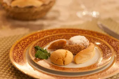 a plate with some food on a table at Villa Des Ambassadors in Rabat