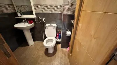 a small bathroom with a toilet and a sink at Joli appartement Casablanca ain sebaa in Casablanca