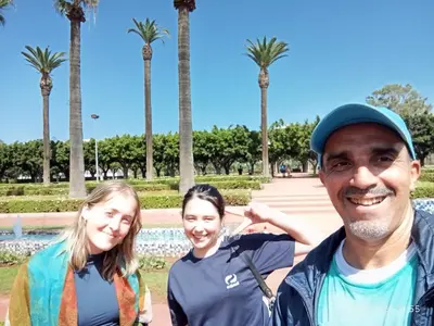 a man and two women standing in a park at Riad Nabila in Casablanca