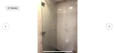 a bathroom with a shower with two parts of it at Villa moderne avec piscine, front de mer in Casablanca