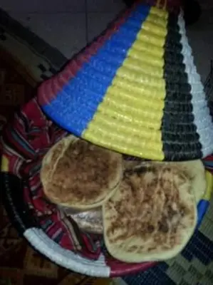 a plate of food with three tortas on a table at Faridi vacancy appartment in Casablanca
