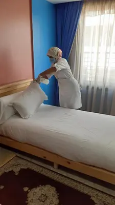 a person standing on a bed in a room at HOTEL DELTA ATLAS in Casablanca