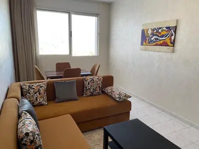 a living room with a couch and a table at Melines in Casablanca