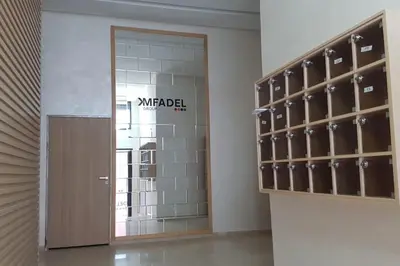 a locker room with a door and a wall of shoes at A 200m de la Plage, du Haut Standing au coeur du Parc in Mohammedia