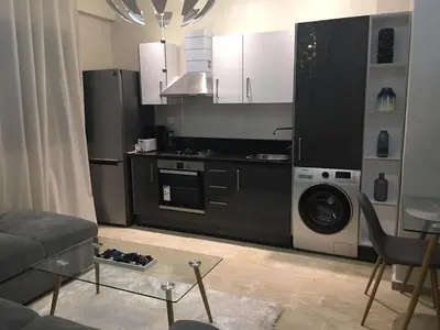 a kitchen with a stove and a dishwasher at A 200m de la Plage, du Haut Standing au coeur du Parc in Mohammedia