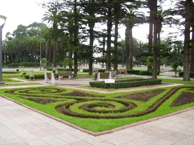 a park with a spiral garden with benches and trees at A 200m de la Plage, du Haut Standing au coeur du Parc in Mohammedia