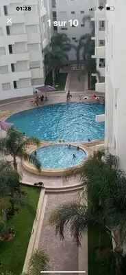 an overhead view of a large swimming pool in a building at Jnane dalia in Bouznika