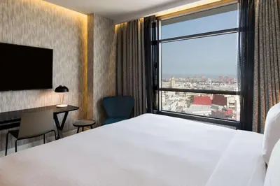a hotel room with a bed and a large window at Radisson Blu Hotel Casablanca City Center in Casablanca