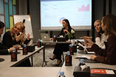 a group of women sitting at tables in a meeting at New Hotel Piscine Wellness & Spa in Casablanca