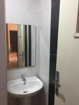 a bathroom with a sink and a mirror at ocean view apartment in Rabat