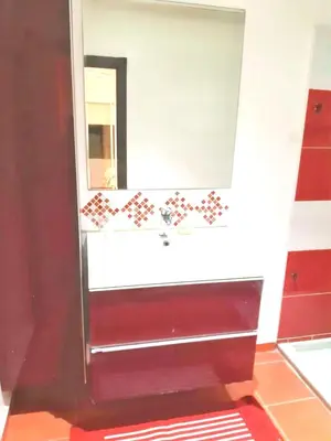 a bathroom with a sink and a mirror at Spacious apartment in Nouaseur of 167 m² in Nouaseur