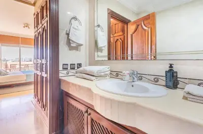 a bathroom with a sink and a mirror at Residence Elite appartement de luxe in Casablanca