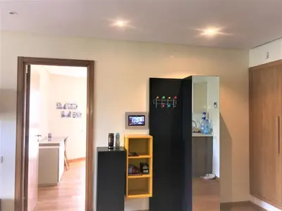 a kitchen with a black refrigerator in a room at Charming Appartement With a Beautifull View 41 in Casablanca