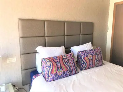 a bed with two pillows on top of it at Charming Appartement With a Beautifull View 41 in Casablanca