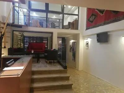 a lobby with stairs leading to a living room at Casa City Break Appart hôtel in Casablanca