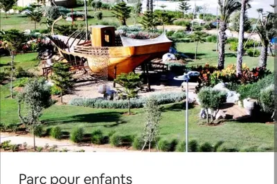 a picture of a boat in a park at Appt BOUZNIKA EDEN ISLAND pied sur Mer pour FAMILLE et Couple MARIE in Bouznika