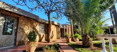 a house with palm trees in front of it at Palmeraie skhirat 2 in Skhirat