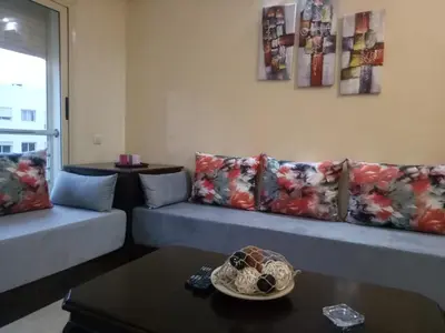 a living room with a couch and a table at Apartment with Terrace in Casablanca