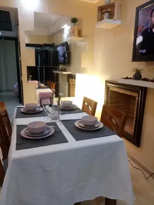 a dining room table with a white table cloth on it at Apartment with Terrace in Casablanca