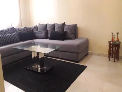 a living room with a couch and a glass table at Apartment with Terrace in Casablanca