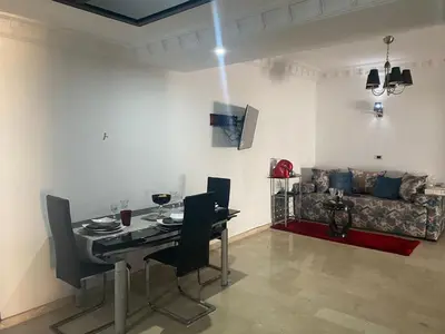 a living room with a table and a couch at Apartment with Terrace in Casablanca