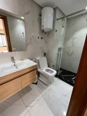 a bathroom with a toilet and a sink and a shower at Luxury appartement in Heart of Casablanca Maarif in Casablanca