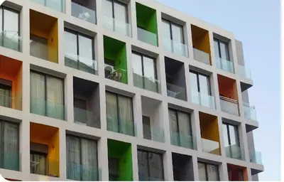 a tall building with colorful windows on it at Luxury appartement in Heart of Casablanca Maarif in Casablanca