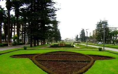 a park with a circle in the grass with trees at Du Haut Standing au coeur du Parc et Plage à 180 m in Mohammedia