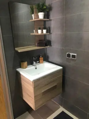 a bathroom with a sink and a mirror at Mansbay Beach, Vue sur Mer, accès Plage à pied, Mohammedia in Mohammedia