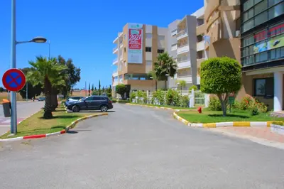 a car driving down a street in a building at Les charmes de la Campagne de Bouznika in Bouznika