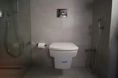a bathroom with a shower and a toilet and a toilet paper roll at Maarif Home Casablanca in Casablanca