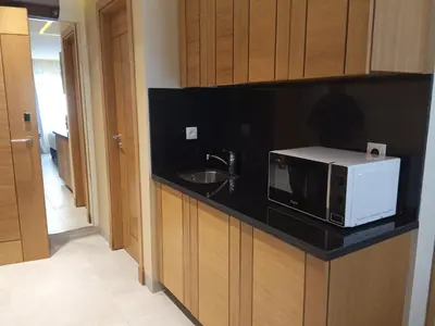 a kitchen with a microwave and a sink at Maarif Home Casablanca in Casablanca