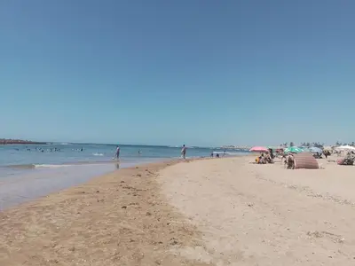 a group of people on a beach with the ocean at Maison Etoile De Mer 1 in Skhirat