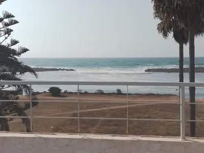 a view of the ocean from a balcony at Maison Etoile De Mer 2 in Skhirat