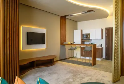 a living room with a television and a table at BH Appart Hotel in Casablanca