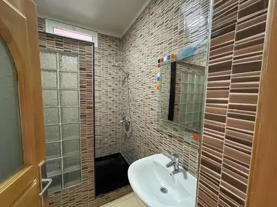 a bathroom with a sink and a mirror at Villa Safaa Dar Bouazza in Dar Mouddene