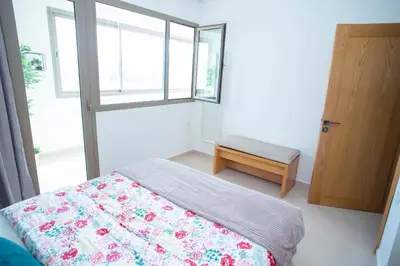 a bedroom with a bed and a window at My Cosy Place Rabat - Appartements à 50m de la gare Agdal TGV in Rabat