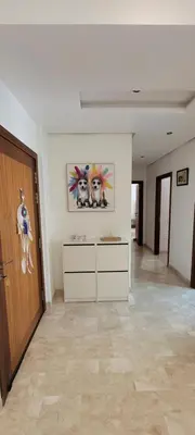 an empty room with a door and a painting on the wall at Apartment Close to Casablanca Mohamed V Airport in Nouaseur